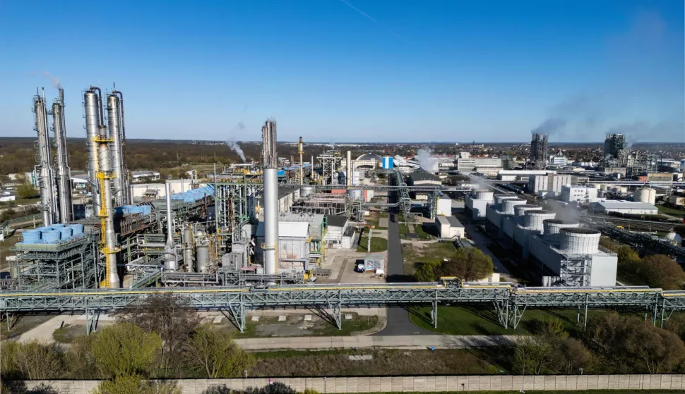 An aerial view shows the SKW Piesteritz agro-chemical plant in Piesteritz near Wittenberg, northern Germany, on April 9, 2026. As the effective closure of the Strait of Hormuz continues to roil the global economy, one German town has been scrambling to help make up the shortfall in essential supplies of fertilisers. Wittenberg, better known to many as a cradle of the Protestant Reformation, is also home to a chemical plant founded in 1915, in the midst of World War One. At SKW's sprawling 220-hectare site, a 23-kilometer rail transports urea, ammonia and finished fertilisers, destined for sites across Germany and also elsewhere in Europe. SKW is Germany's largest producer of urea, an essential component of fertilisers. The plant has been running at full capacity to try to make up the shortfall in supply from the Hormuz blockade. (Photo by John MACDOUGALL/AFP)