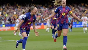 Barcelona's Polish forward #17 Ewa Pajor celebrates with Barcelona's Spanish midfielder #11 Alexia Putellas (R) scoring her team's third goal during the UEFA Women's Champions League semi-final second leg football match between FC Barcelona and Bayern Munich at Camp Nou Stadium in Barcelona on May 3, 2026. (Photo by MANAURE QUINTERO/AFP)
