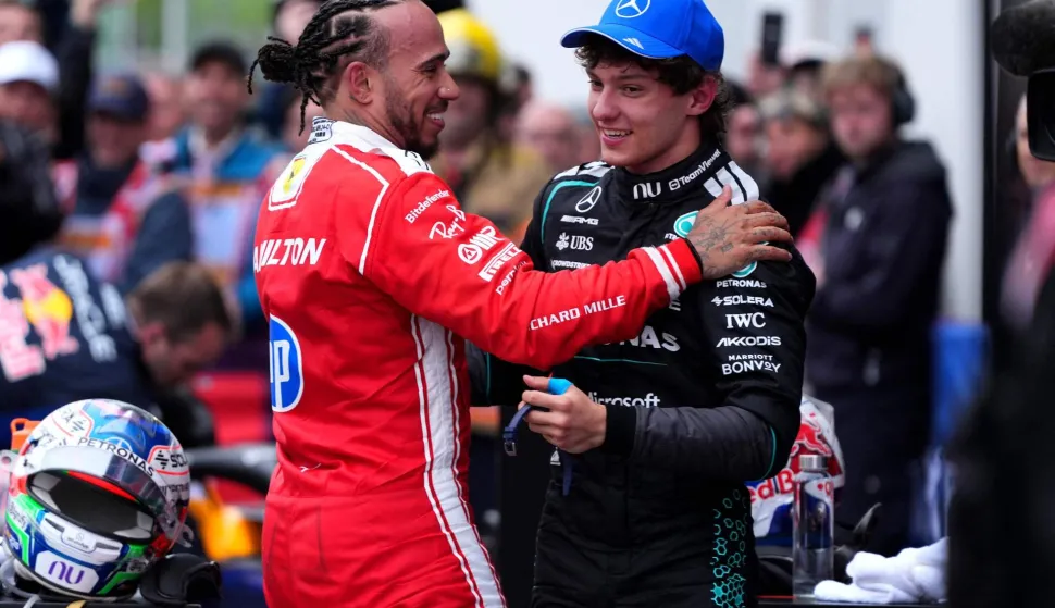 MONTREAL, QUEBEC - MAY 24: Race winner Andrea Kimi Antonelli of Italy and Mercedes AMG Petronas F1 Team and Second placed Lewis Hamilton of Great Britain and Scuderia Ferrari talk in parc ferme during the F1 Grand Prix of Canada at Circuit Gilles-Villeneuve on May 24, 2026 in Montreal, Quebec. Sona Maleterova/Getty Images/AFP (Photo by Sona Maleterova/GETTY IMAGES NORTH AMERICA/Getty Images via AFP)