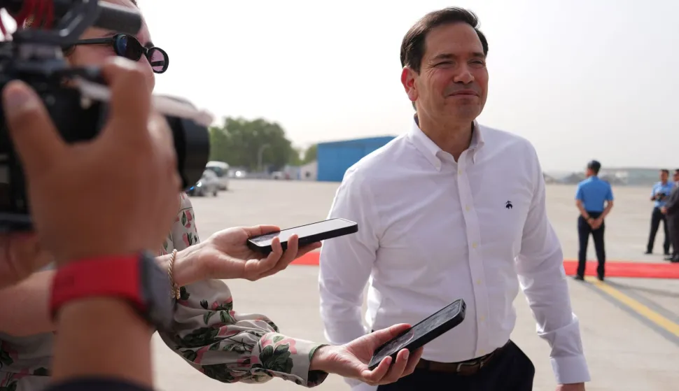 US Secretary of State Marco Rubio speaks to journalists before boarding his plane at Indira Gandhi International Airport in New Delhi on May 25, 2026. (Photo by Julia Demaree Nikhinson/POOL/AFP)