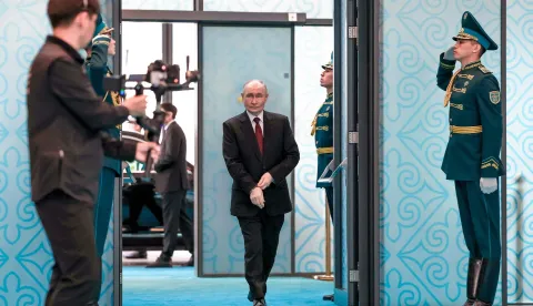 In this pool photograph distributed by the Russian state agency Sputnik Russian President Vladimir Putin walks at the Palace of Independence during his state visit to Kazakhstan in Astana on May 29, 2026. (Photo by Alexander KAZAKOV/POOL/AFP)