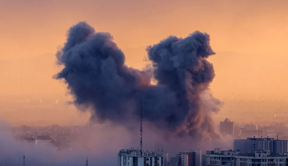TOPSHOT - A plume of smoke rises after a strike on the Iranian capital Tehran, on March 3, 2026. Iran stepped up its attacks on economic targets and US missions across the Middle East on Tuesday as the US president warned it was "too late" for the Islamic republic to seek talks to escape the war. The United States and Israel launched strikes against Iran on February 28, with the killing of Iran's supreme leader and the Islamic republic retaliated with barrages of missiles at Gulf states and Israel. (Photo by ATTA KENARE/AFP)