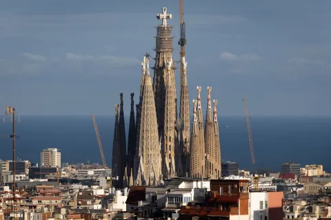 (FILES) A picture taken on March 9, 2026 shows a view of Spanish architect Antoni Gaudi's Sagrada Familia Basilica in Barcelona. Antoni Gaudi was an extraordinary architect, creator of the Sagrada Familia and Park G?ell, and an icon of tourist Barcelona, but also a devout Catholic who is now ever closer to the beatification once envisioned for him by a group of admirers in Barcelona. Almost five million people entered the Sagrada Familia with a ticket last year, making it the most visited paid monument in Spain, while Gaud?s major works rank among the most in-demand attractions in the city. (Photo by Josep LAGO/AFP)