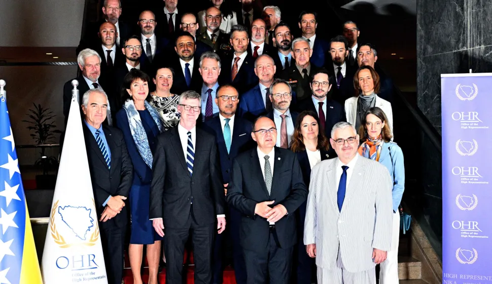 Bosnia's outgoing High Representative, Christian Schmidt (C-R), ambassadors and diplomats and members of the Diplomatic corps in Bosnia and Herzegovina pose for a family photo prior to a session of the Steering Board of the Peace Implementation Council in Sarajevo, on June 3, 2026. A board tasked with appointing Bosnia's new top international envoy met in Sarajevo amid European and US disagreements over the scope and powers of the position. Outgoing High Representative Christian Schmidt resigned in May in what he described as a surprise departure citing "huge and unexpected" pressure from Washington. (Photo by ELVIS BARUKCIC/AFP)