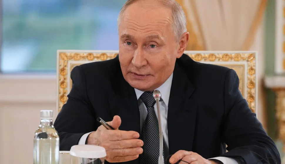 Russian President Vladimir Putin speaks during a meeting with representatives of international news agencies on the sidelines of the St. Petersburg International Economic Forum at the Constantine Palace in Saint Petersburg on June 4, 2026. (Photo by Dmitry LOVETSKY/POOL/AFP)