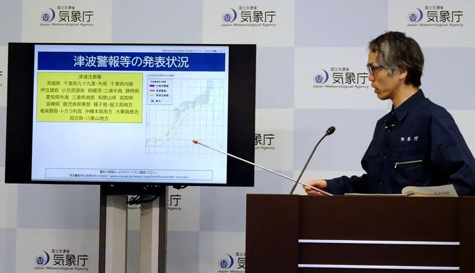 An official from the Japan Meteorological Agency's Earthquake and Tsunami Countermeasures Planning Office holds a press conference in Tokyo on June 8, 2026, regarding a tsunami warning issued in response to an offshore earthquake that struck some 24 kilometres west of Mindanao island in the southern Phlippines. Japanese authorities issued a tsunami advisory on June 8 along swathes of its Pacific coast after a major earthquake off the Philippines. (Photo by JIJI PRESS/AFP)/Japan OUT
