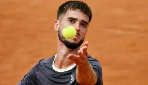 Croatia's Dino Prizmic serves to Russia's Karen Khachanov during the ATP Rome Open tennis tournament at Foro Italico in Rome on May 12, 2026. (Photo by Andreas SOLARO/AFP)