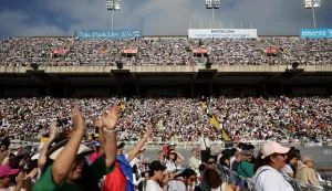 Faithfuls celebrate as they wait prior a prayer vigil at the Lluis Companys Olympic Stadium in Barcelona, on June 9, 2026. Pope Leo XIV is visiting Spain June 6-12 with stops in Madrid, Barcelona, and the Canary Islands, where he will meet with migrants and organisations dedicated to helping them. (Photo by Josep LAGO/AFP)