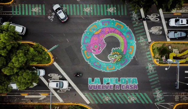 A drone view shows an intersection painted with the phrase "La pelota vuelve a casa" ("The ball returns home") alongside an image of the critically endangered axolotl, a salamander native to central Mexico's lakes, as its use in public imagery ahead of the FIFA World Cup 2026 has divided residents who say more should be done to protect its habitat, in Mexico City, Mexico, May 27, 2026. REUTERS/Raquel Cunha Photo: Raquel CUNHA/REUTERS