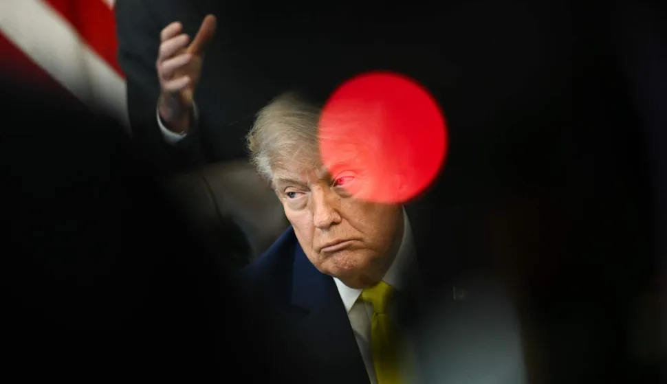 US President Donald Trump looks on during an announcement about coal, in the Oval Office of the White House in Washington, DC on June 4, 2026. President Trump on Thursday announced he was using Cold War era legislation to tap $700 million in funding for a slew of coal plants and mines and an export terminal. (Photo by Brendan SMIALOWSKI/AFP)