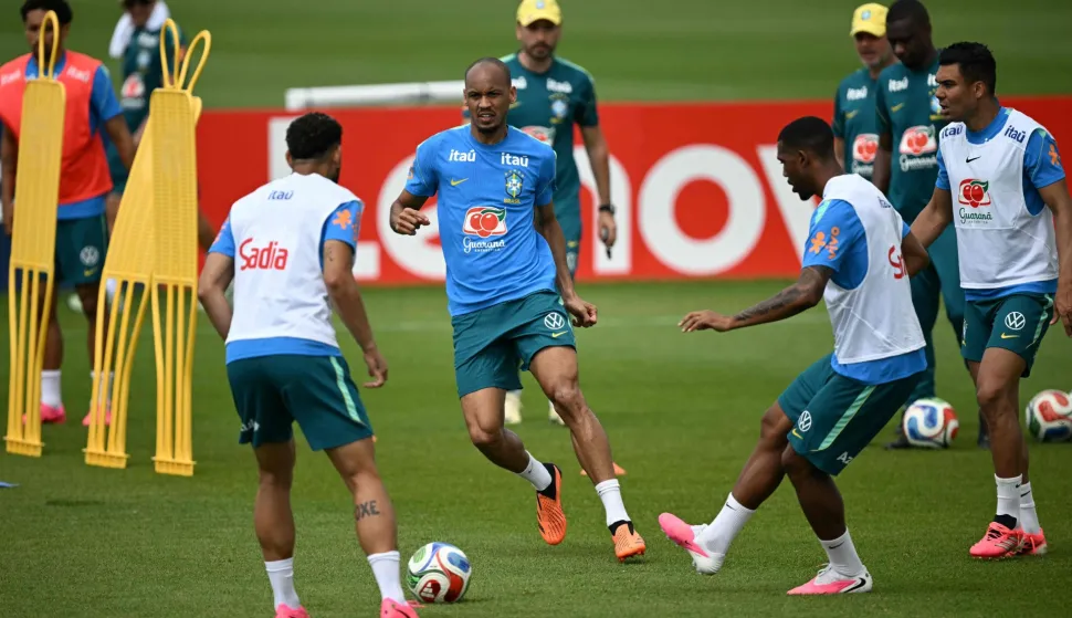 Brazil's midfielder #17 Fabinho (C), Brazil's forward #26 Rayan (2nd R) and Brazil's midfielder #05 Casemiro (R) take part in a training session during the 2026 World Cup football tournament at Columbia Park Training Facility in Morristown, New Jersey, on June 11, 2026. (Photo by MAURO PIMENTEL/AFP)