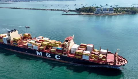 Aerial view of the MSC Alanya container ship sailing under the Monrovia flag after leaving the Panama Canal in Panama City on April 21, 2026. According to the Panama Canal Authority, transit through the canal has increased due to the war in the Middle East. (Photo by MARTIN BERNETTI/AFP)