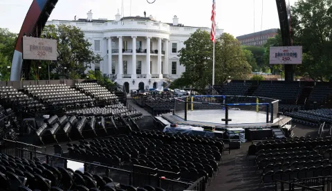 Seating and "The Octagon" fighting enclosure for the upcoming UFC fight that US President Donald Trump will host as part of the 250th anniversary of the United States is seen on the South Lawn of the White House during a media preview in Washington, DC, June 11, 2026. The Ultimate Fighting Championship (UFC) event will be held on US President Donald Trump's 80th birthday on June 14. (Photo by SAUL LOEB/AFP)