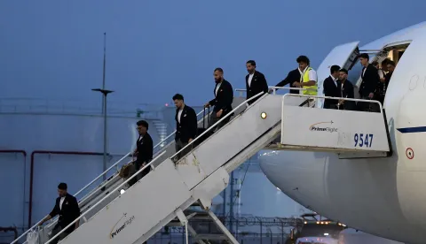 Iran's players disembark on arrival at the Tijuana International Airport in Tijuana, Mexico on June 7, 2026, ahead of the FIFA 2026 World Cup football tournament. (Photo by Guillermo Arias/AFP)