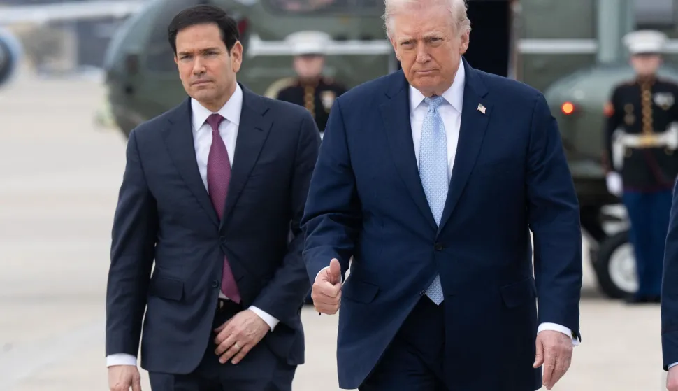(FILES) US President Donald Trump and US Secretary of State Marco Rubio walk to board Air Force One prior to departure from Joint Base Andrews in Maryland, March 20, 2026, as they travel to Florida for the weekend. US President Donald Trump said on May 23 that Iran and the US had "largely negotiated" a deal that included opening the Strait of Hormuz, but the draft was "subject to finalization." (Photo by SAUL LOEB/AFP)