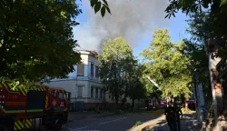 Firefighters work near the damaged Kharkiv Art Museum following a drone strike in Kharkiv on June 14, 2026, amid the Russian invasion of Ukraine. (Photo by SERGEY BOBOK/AFP)