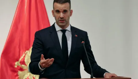 Montenegro's Prime Minister Milojko Spajic delivers a statement flanked by France's President following a signing ceremony during Macron's first official visit to Montenegro in Cetinje on June 4, 2026. (Photo by Ludovic MARIN/AFP)