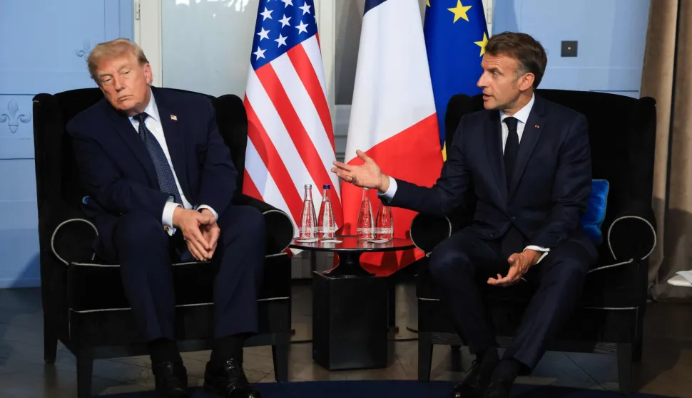 TOPSHOT - US President Donald Trump (L) attends a bilateral meeting with France's President Emmanuel Macron on the sidelines of the G7 summit, in Evian, central-eastern France on June 15, 2026. A G7 summit is set to take place June 15 to 17 in the French town of Evian-les-Bains near Switzerland and it will be attended by country leaders as well as the EU's foreign policy chief and ministers from Brazil, Canada, the United Arab Emirates and Turkey. (Photo by Ludovic MARIN/POOL/AFP)
