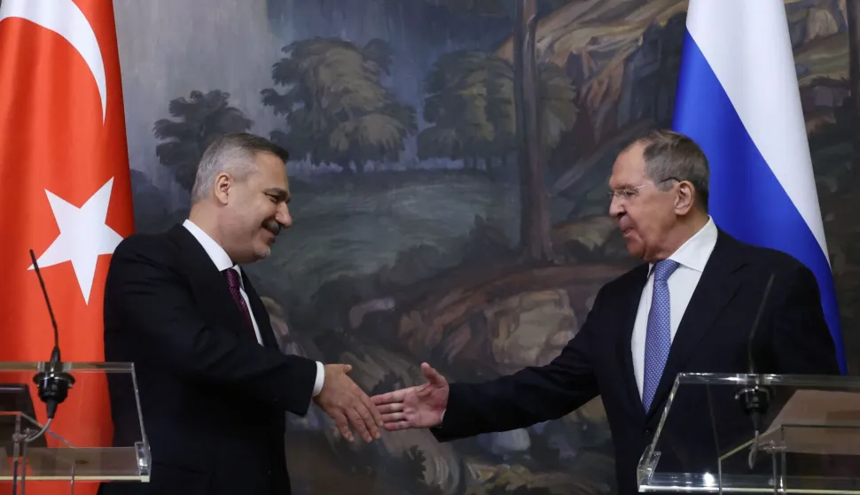 Russian Foreign Minister Sergei Lavrov and his Turkish counterpart Hakan Fidan shake hands during a joint press conference following their meeting in Moscow on June 16, 2026. (Photo by SERGEI ILNITSKY/POOL/AFP)