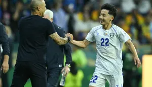 Uzbekistan's midfielder #22 Abbosbek Fayzullaev celebrates scoring his team's first goal with Italian head coach Fabio Cannavaro during the 2026 World Cup Group K football match between Uzbekistan and Colombia at the Mexico City Stadium in Mexico City on June 17, 2026. (Photo by Yuri CORTEZ/AFP)