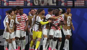 LOS ANGELES, CALIFORNIA - JUNE 12: Folarin Balogun #20 of the United States celebrates scoring his team's third goal with team mates during the FIFA World Cup 2026 Group D match between USA and Paraguay at Los Angeles Stadium on June 12, 2026 in Los Angeles, California. Jamie Squire/Getty Images/AFP (Photo by JAMIE SQUIRE/GETTY IMAGES NORTH AMERICA/Getty Images via AFP)