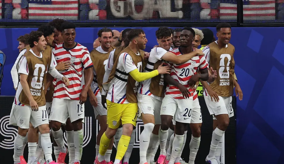 LOS ANGELES, CALIFORNIA - JUNE 12: Folarin Balogun #20 of the United States celebrates scoring his team's third goal with team mates during the FIFA World Cup 2026 Group D match between USA and Paraguay at Los Angeles Stadium on June 12, 2026 in Los Angeles, California. Jamie Squire/Getty Images/AFP (Photo by JAMIE SQUIRE/GETTY IMAGES NORTH AMERICA/Getty Images via AFP)