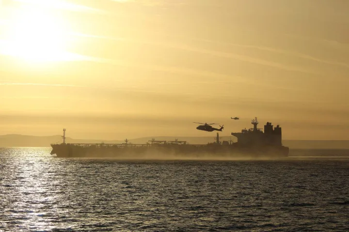 This handout picture taken on June 14, 2026 and released by the British Ministry of Defence (MOD) shows 42 Commando of the UK Commando force conducting maritime interdiction operations on the CMR Smyrtos sailing under a false Cameroonian flag, in the English Channel off the coast of the United Kingdom. British forces on June 14 intercepted a sanctioned oil tanker belonging to Russia's shadow fleet in the English Channel, the defence ministry said, in a six-hour operation hailed by Kyiv. (Photo by Ministry of Defence (United Kingdom)/AFP)/- NO Marketing campaign/-----EDITORS NOTE --- RESTRICTED TO EDITORIAL USE - MANDATORY CREDIT "AFP PHOTO/UK Ministry of Defence CROWN COPYRIGHT, 2026 " - NO MARKETING - NO ADVERTISING CAMPAIGNS - DISTRIBUTED AS A SERVICE TO CLIENTS - NO ARCHIVES - TO BE USED WITHIN 2 DAYS FROM JUNE 14, 2026 (48 HOURS), EXCEPT FOR MAGAZINES WHICH CAN PRINT THE PICTURE WHEN FIRST REPORTING ON THE EVENT/