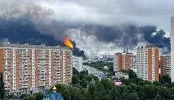 TOPSHOT - Black smoke rises from the area of the Russian oil producer Gazprom Neft's Moscow oil refinery on the south-eastern outskirts of Moscow on June 18, 2026. Moscow was fending off a "large-scale" drone attack from Ukraine, with several drones reaching an oil refinery, the city's mayor Sergey Sobyanin said early on June 18, 2026. (Photo by AFP)