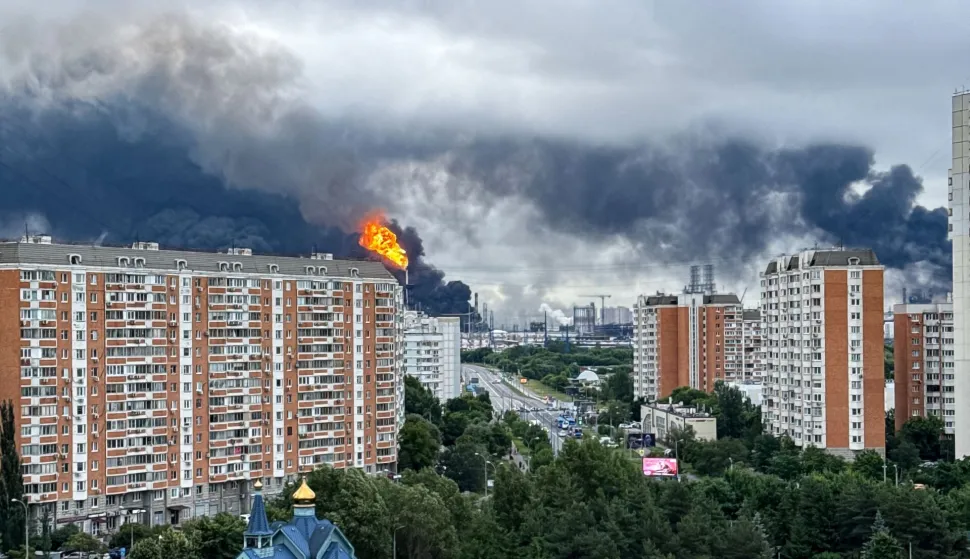 TOPSHOT - Black smoke rises from the area of the Russian oil producer Gazprom Neft's Moscow oil refinery on the south-eastern outskirts of Moscow on June 18, 2026. Moscow was fending off a "large-scale" drone attack from Ukraine, with several drones reaching an oil refinery, the city's mayor Sergey Sobyanin said early on June 18, 2026. (Photo by AFP)