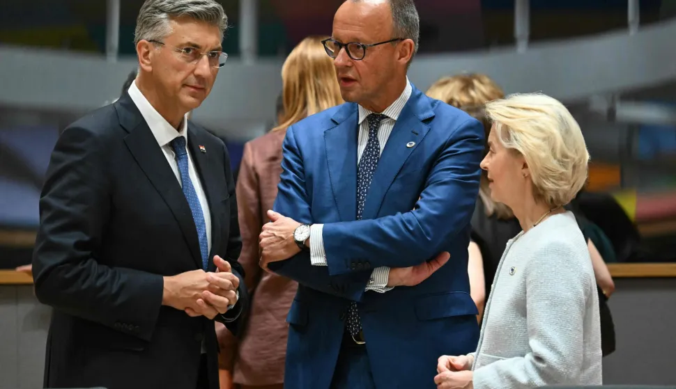 Croatia's Prime Minister Andrej Plenkovic (L) Germany's Chancellor Friedrich Merz (C) and European Commission President Ursula von der Leyen attend round table meeting during the EU Summit at the EU headquarters in Brussels, on June 18, 2026. (Photo by NICOLAS TUCAT/AFP)