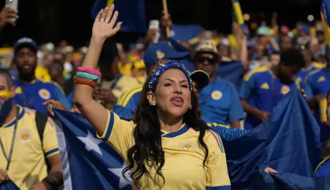 A Curacao fan cheers for her team ahead of the 2026 World Cup Group E football match between Ecuador and Curacao at the Kansas City Stadium in Kansas City on June 20, 2026. (Photo by JUAN MABROMATA/AFP)