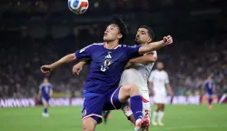Japan's forward #18 Ayase Ueda and Tunisia's defender #21 Mohamed Ben Hamida fight for the ball during the 2026 World Cup Group F football match between Tunisia and Japan at the Monterrey Stadium in Guadalupe, Mexico, on June 20, 2026. (Photo by Julio Cesar AGUILAR/AFP)