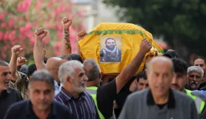 Mourners carry the coffin of Hezbollah fighter Hassan Ali Kallas, from the southern Lebanese village of Nabatieh al Fawka, during his funeral at a temporary cemetery in the southern coastal Lebanese city of Sidon on June 11, 2026. Lebanon's health ministry said Israeli airstrikes on the country's south on June 10, killed 12 people, as Israeli Prime Minister Benjamin Netanyahu urged the Lebanese to join Israel's fight against Hezbollah. Neither Israel nor Hezbollah has observed an April ceasefire in Lebanon, and the latest war has continued despite a conditional truce deal announced last week after Lebanese-Israeli talks in Washington. (Photo by Anwar AMRO/AFP)