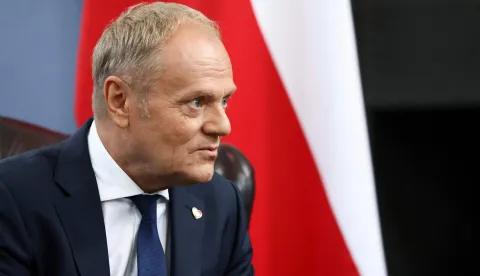 Poland's Prime Minister Donald Tusk attends a bilateral meeting with Britain's Prime Minister Keir Starmer (not pictured) at the Royal Air Force (RAF) base in Northolt, near London on May 27, 2026. The British and Polish prime ministers are meeting to sign a defence and security treaty between the two countries. (Photo by Jack Taylor/POOL/AFP)