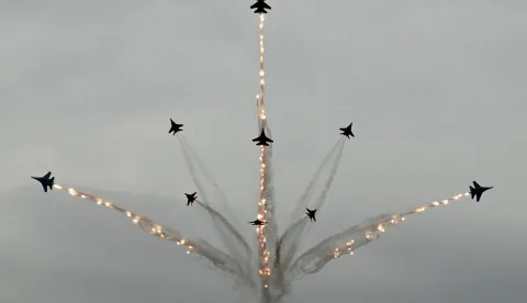 TOPSHOT - Russia's MiG-29 jet fighters of the Strizhi (Swifts) and Su-30SM jet fighters of the Russkiye Vityazi (Russian Knights) aerobatic teams perform during the International Maritime Defence Show "Fleet" 2026 in Kronstadt on June 10, 2026. (Photo by Olga MALTSEVA/AFP)