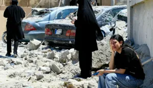 TOPSHOT - A Lebanese woman weeps as she sits on the rubble at the site of an Israeli airstrike that targeted the southern Lebanese village of Qennarit on June 20, 2026. Israel carried out deadly strikes in south Lebanon on June 20, and Hezbollah maintained it had the right to respond, hours after the United States announced a renewed ceasefire in fighting that had strained a fledgling deal with Iran. Lebanon was drawn into the Middle East war on March 2 when Tehran-backed militant group Hezbollah launched attacks on Israel to avenge the killing of the Iranian leader. Israel has responded with broad strikes across Lebanon and a ground offensive. (Photo by AFP)/