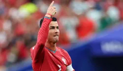 HOUSTON, TEXAS - JUNE 23: Cristiano Ronaldo #7 of Portugal celebrates scoring his team's first goal during the FIFA World Cup 2026 Group K match between Portugal and Uzbekistan at Houston Stadium on June 23, 2026 in Houston, Texas. Michael Steele/Getty Images/AFP (Photo by MICHAEL STEELE/GETTY IMAGES NORTH AMERICA/Getty Images via AFP)