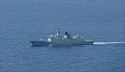 A ship identified by the Philippine Coast Guard as a Chinese Navy vessel is seen near Scarborough Shoal in the disputed South China Sea on June 15, 2026. (Photo by Jam STA ROSA/AFP)