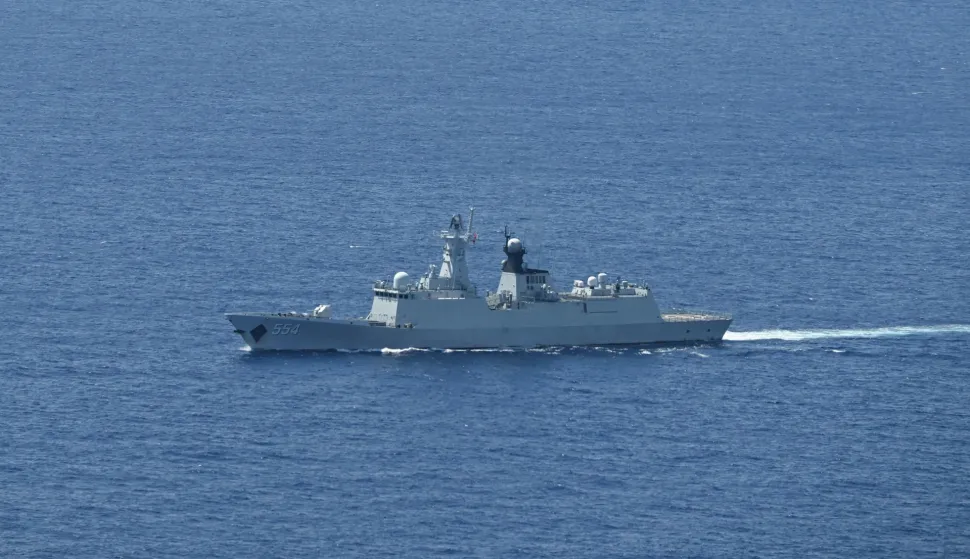A ship identified by the Philippine Coast Guard as a Chinese Navy vessel is seen near Scarborough Shoal in the disputed South China Sea on June 15, 2026. (Photo by Jam STA ROSA/AFP)