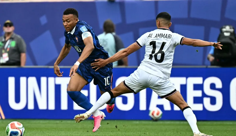 France's forward #10 Kylian Mbappe andIraq's midfielder #16 Amir Al Ammari fight for the ball during the 2026 World Cup Group I football match between France and Iraq at the Philadelphia Stadium in Philadelphia on June 22, 2026. (Photo by Jewel SAMAD/AFP)