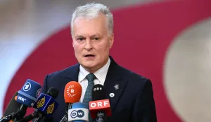 Lithuania's President Gitanas Nauseda delivers remarks to journalists upon arrival to attend the EU Summit at the EU headquarters in Brussels, on June 18, 2026. (Photo by NICOLAS TUCAT/AFP)