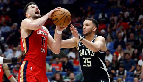 NEW ORLEANS, LOUISIANA - FEBRUARY 20: Karlo Matkovic #17 of the New Orleans Pelicans is defended by Pete Nance #35 of the Milwaukee Bucks during the second half of a game at Smoothie King Center on February 20, 2026 in New Orleans, Louisiana. NOTE TO USER: User expressly acknowledges and agrees that, by downloading and or using this photograph, User is consenting to the terms and conditions of the Getty Images License Agreement. Tyler Kaufman/Getty Images/AFP (Photo by Tyler Kaufman/GETTY IMAGES NORTH AMERICA/Getty Images via AFP)