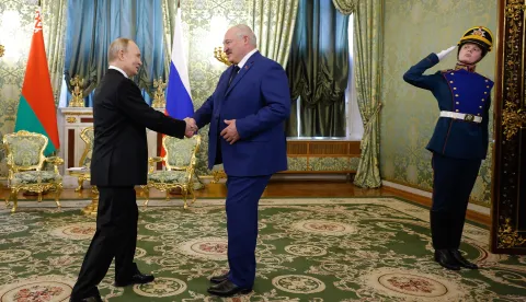 epa11960790 Russian President Vladimir Putin (L) shakes hands with Belarusian President Alexander Lukashenko (C) during their meeting at the Kremlin in Moscow, Russia, 13 March 2025. Lukashenko is on an official visit to Moscow. EPA/MAXIM SHEMETOV/POOL