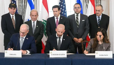 US Secretary of State Marco Rubio (C, back) looks on as (L/R, front row) Israeli Ambassador to the US Yechiel Leiter, State Department Chief of Staff Daniel Holler, and Lebanese Ambassador to the US Nada Hamadeh sign a framework agreement at the US Department of State in Washington, DC, on June 26, 2026. Lebanon, Israel and the United States on Friday signed a trilateral framework agreement aimed at paving the way for a peace deal between the two long-time Middle East adversaries. (Photo by SAUL LOEB/AFP)