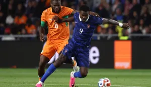Ivory Coast's midfielder #08 Franck Kessie (L) and France's forward #09 Marcus Thuram (R) fight for the ball during the international friendly football match between France and Ivory Coast ahead of the 2026 FIFA World Cup football tournament at the Stade de la Beaujoire in Nantes, western France, on June 4, 2026. (Photo by FRANCK FIFE/AFP)