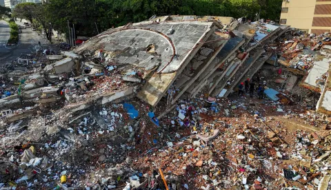 Aerial view of collapsed buildings in Caraballeda, La Guaira state, Venezuela, on June 30, 2026, following earthquakes. Tens of thousands of people urgently need food and shelter in Venezuela due to the devastation from two huge earthquakes that killed more than 1,700 and injured 5,000, the UN said on June 30, 2026, as doctors warned of potential outbreaks of disease. (Photo by Miguel MEDINA/AFP)