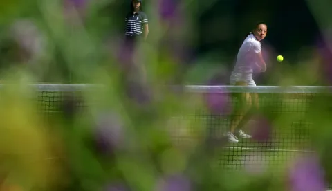 Croatia's Antonia Ruzic returns to Latvia's Darja Semenistaja during their women's singles first round tennis match on the first day of the 2026 Wimbledon Championships at The All England Lawn Tennis and Croquet Club in Wimbledon, southwest London, on June 29, 2026. (Photo by Adrian Dennis/AFP)/RESTRICTED TO EDITORIAL USE