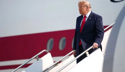 BISMARCK, NORTH DAKOTA - JULY 01: U.S. President Donald Trump departs Air Force One as he arrives at Bismarck Municipal Airport on July 01, 2026 in Bismarck, North Dakota. While in North Dakota, President Trump will ride a Freedom250-themed NextGen Acela train celebrating the nation's 250th anniversary before delivering remarks at a dedication ceremony for the Theodore Roosevelt Presidential Library. Andrew Harnik/Getty Images/AFP (Photo by Andrew Harnik/GETTY IMAGES NORTH AMERICA/Getty Images via AFP)