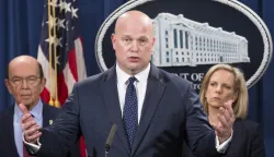 epaselect epa07328401 Acting Attorney General Matthew Whitaker (C) speaks beside US Secretary of Commerce Wilbur Ross (L) and US Secretary of Homeland Security Kirstjen Nielsen (R) during a news conference held to announce law enforcement action related to Huawei Technologies Co. Ltd. of China, at the Justice Department in Washington, DC, USA, 28 January 2019. Officials from the US Justice Department, US Department of Homeland Security and US Commerce Department attended the news conference to announce criminal charges related to Chinese telecommunications conglomerate Huawei. US authorities announced a thirteen-count indictment charging four defendants; Huawei, two Huawei affiliates and Huawei's chief financial officer Meng Wanzhou. EPA/MICHAEL REYNOLDS