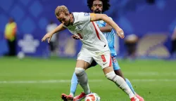 ATLANTA, GEORGIA - JULY 01: Harry Kane #9 of England is challenged by Samuel Moutoussamy #8 of Congo DR during the FIFA World Cup 2026 Round Of 32 match between England and Congo DR at Atlanta Stadium on July 01, 2026 in Atlanta, Georgia. Michael Reaves/Getty Images/AFP (Photo by Michael Reaves/GETTY IMAGES NORTH AMERICA/Getty Images via AFP)